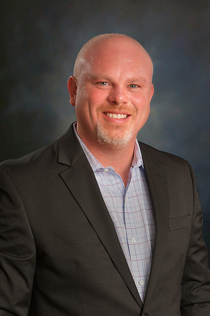 MB Biz Head-28 cropped retouched blue gray background